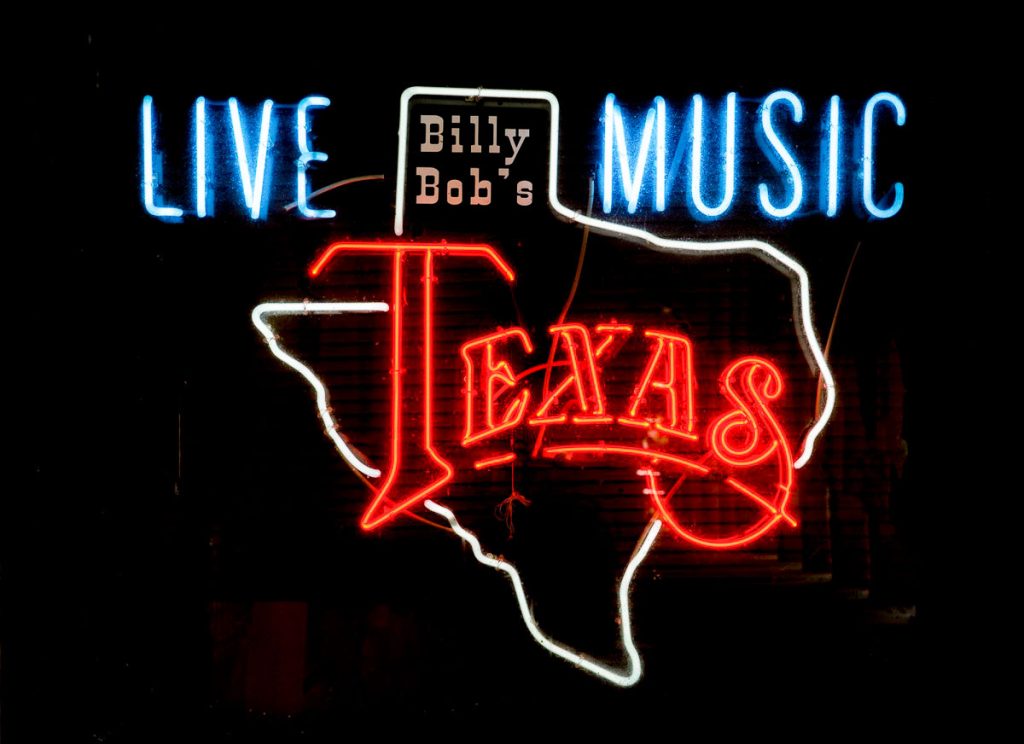 Light up neon sign with an outline of Texas.
