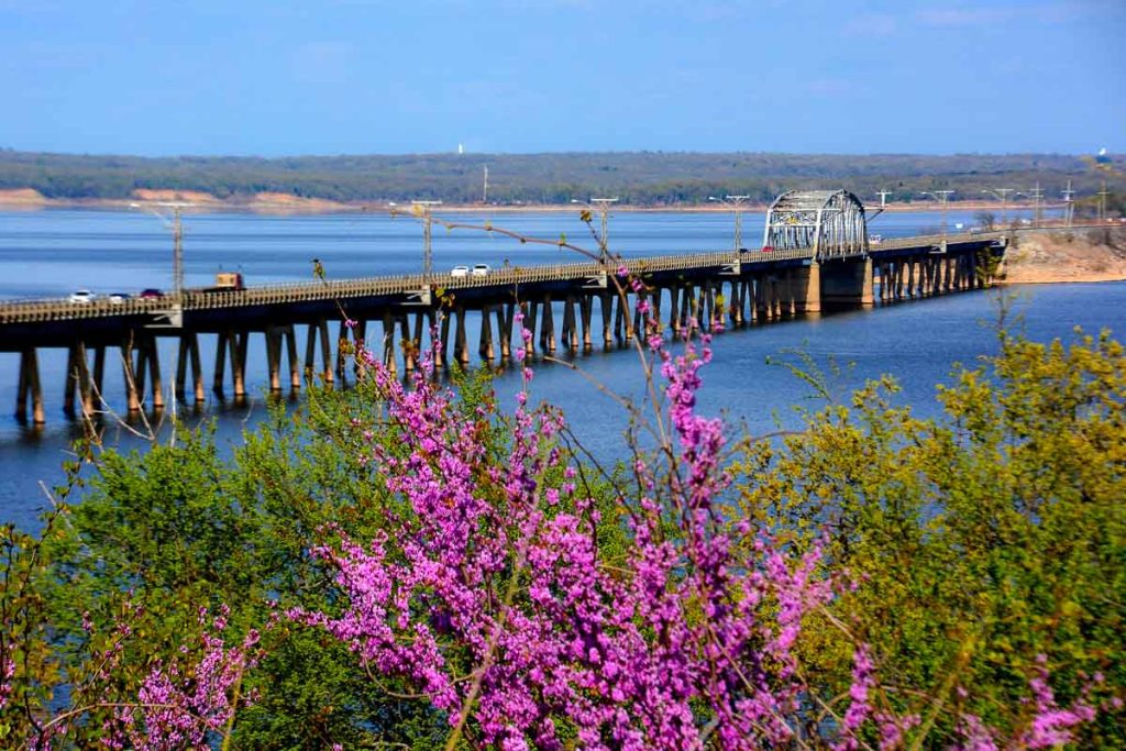 Scenic bridge over a lake.