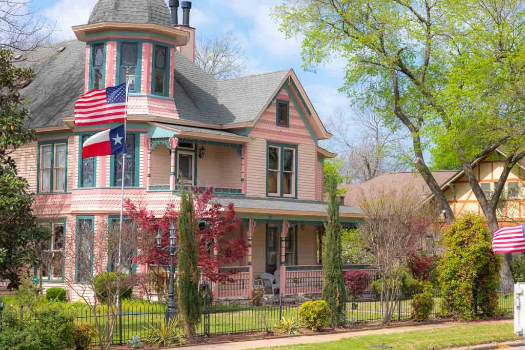Pink and teal Victorian House in Texas.